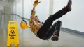 Worker falling on wet floor inside building