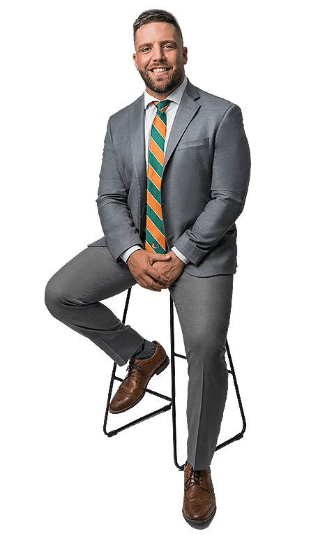 Anthony Melchiorre seated on stool