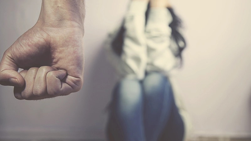 Man about to beat his wife.